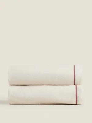 Cream blanket with red stripe